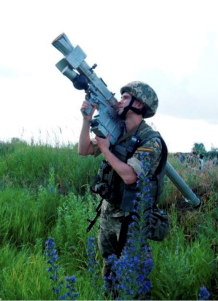 Ukrainian Soldier Aims Missile
